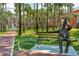 Bronze statue on bench with walkway to the serene campus of Stetson University at 603 W Miles St, Deland, FL 32720