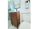 Close up of a modern bathroom vanity with a wood cabinet, a sleek sink, and a contemporary design at 68 Hibiscus Dr, Ormond Beach, FL 32176