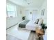 Light bedroom with a bed and decor at 68 Hibiscus Dr, Ormond Beach, FL 32176