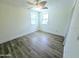 Simple bedroom with ceiling fan and windows at 68 Hibiscus Dr, Ormond Beach, FL 32176
