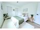 Light bedroom with a bed and decor at 68 Hibiscus Dr, Ormond Beach, FL 32176