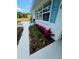 Well maintained lawn with vibrant flower beds and careful landscaping details at the front of the property at 68 Hibiscus Dr, Ormond Beach, FL 32176