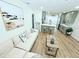 Bright living room open to kitchen, with a comfortable sofa and beach-themed decor at 68 Hibiscus Dr, Ormond Beach, FL 32176