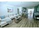 Cozy living room connected to the kitchen, featuring comfortable seating and modern decor at 68 Hibiscus Dr, Ormond Beach, FL 32176