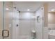 Bright bathroom featuring a glass shower with decorative tile and modern fixtures at 1239 Ocean Shore Blvd # 11D, Ormond Beach, FL 32176