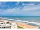 Beautiful view of the beach with azure ocean water and cloud scattered blue skies at 1239 Ocean Shore Blvd # 11D, Ormond Beach, FL 32176