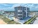 An exterior view of the condo with pool and beach access at 1239 Ocean Shore Blvd # 11D, Ormond Beach, FL 32176