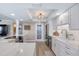 Well-lit kitchen with an island, stainless steel appliances and neutral cabinetry at 1239 Ocean Shore Blvd # 11D, Ormond Beach, FL 32176