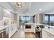 Modern kitchen with white cabinets, stainless steel appliances, and a stylish island featuring views of the intracoastal at 1239 Ocean Shore Blvd # 11D, Ormond Beach, FL 32176