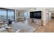 Open-concept living room boasts ocean views, comfortable seating, and modern decor with luxury vinyl plank flooring at 1239 Ocean Shore Blvd # 11D, Ormond Beach, FL 32176