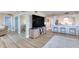 Bright open floorplan features a living room and a kitchen with luxury vinyl plank flooring at 1239 Ocean Shore Blvd # 11D, Ormond Beach, FL 32176