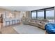 Bright open floorplan features a living room with ocean views and a bar that connects to a modern kitchen at 1239 Ocean Shore Blvd # 11D, Ormond Beach, FL 32176
