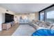 Bright living room and kitchen features luxury vinyl plank flooring and a ocean view at 1239 Ocean Shore Blvd # 11D, Ormond Beach, FL 32176