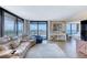 Bright living room with comfortable seating, balcony access, and stunning views of the ocean and intracoastal at 1239 Ocean Shore Blvd # 11D, Ormond Beach, FL 32176