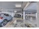 This parking garage offers ample space and overhead lighting for tenant parking at 1239 Ocean Shore Blvd # 11D, Ormond Beach, FL 32176