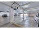 Spacious parking garage for tenants with assigned parking spots and overhead lighting at 1239 Ocean Shore Blvd # 11D, Ormond Beach, FL 32176