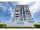 Exterior low angle view of condo signage with a blue sky background at 1239 Ocean Shore Blvd # 11D, Ormond Beach, FL 32176