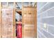 A storage area with wooden doors and caged-off sections to store personal belongings at 1239 Ocean Shore Blvd # 11D, Ormond Beach, FL 32176