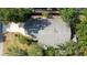 Overhead view of a home with mature trees, a driveway, and a gray roof at 1317 Northside Dr, Ormond Beach, FL 32174