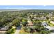An aerial view of a quiet neighborhood with plenty of green space and trees at 1317 Northside Dr, Ormond Beach, FL 32174