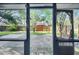 Covered patio offering a view of the backyard with a wooden fence at 1317 Northside Dr, Ormond Beach, FL 32174