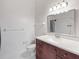 Bathroom featuring a walk-in shower and wood vanity cabinet with drawers, countertop, sink, and chrome faucet at 1317 Northside Dr, Ormond Beach, FL 32174