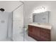 Bathroom featuring a walk-in shower and wood vanity cabinet with drawers, countertop, sink, and chrome faucet at 1317 Northside Dr, Ormond Beach, FL 32174