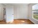Comfortable bedroom with hardwood floors, natural light, and closet at 1317 Northside Dr, Ormond Beach, FL 32174