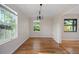Empty dining room with hardwood floors, neutral walls, and natural light at 1317 Northside Dr, Ormond Beach, FL 32174