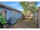 The home's exterior features a fenced yard and HVAC unit at 1317 Northside Dr, Ormond Beach, FL 32174