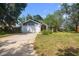 Inviting home with a well-maintained lawn, a large garage, and attractive curb appeal at 1317 Northside Dr, Ormond Beach, FL 32174