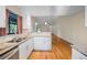 Spacious kitchen with granite countertops, stainless steel sink, and hardwood flooring at 1317 Northside Dr, Ormond Beach, FL 32174