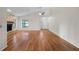 Open living room with hardwood floors, vaulted ceilings, and a stone fireplace at 1317 Northside Dr, Ormond Beach, FL 32174