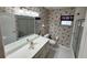 This bathroom features a single sink vanity, shower, toilet, and decorative wallpaper at 16 Hunt Master Ct, Ormond Beach, FL 32174
