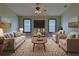 Nicely decorated bedroom with a bed, sofa, rug, and mounted TV at 16 Hunt Master Ct, Ormond Beach, FL 32174