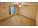 Bedroom featuring a carpeted floor, a ceiling fan, and a window at 16 Hunt Master Ct, Ormond Beach, FL 32174