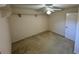 This carpeted bedroom features a ceiling fan, standard closet, and neutral paint at 16 Hunt Master Ct, Ormond Beach, FL 32174