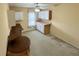 Bonus room with carpeted floor, built-in shelves, desk area, and natural light at 16 Hunt Master Ct, Ormond Beach, FL 32174