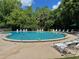 Enjoy the outdoors with this inviting community pool and relaxing lounge chairs at 16 Hunt Master Ct, Ormond Beach, FL 32174