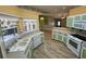 Well-lit kitchen overlooking the open layout living area at 16 Hunt Master Ct, Ormond Beach, FL 32174