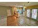 Bright, combined kitchen and dining area with unique light fixture and exterior access at 16 Hunt Master Ct, Ormond Beach, FL 32174