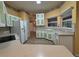 Bright kitchen featuring white cabinets, modern appliances, and laminate countertops at 16 Hunt Master Ct, Ormond Beach, FL 32174