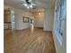 Open-concept living space featuring hardwood floors and modern lighting fixtures at 16 Hunt Master Ct, Ormond Beach, FL 32174