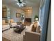 Stylish living room with comfortable seating, a decorative rug, and ample natural light at 16 Hunt Master Ct, Ormond Beach, FL 32174