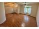 Bright living room featuring wood floors, large windows, and high ceilings with decorative lighting at 16 Hunt Master Ct, Ormond Beach, FL 32174