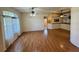 Open-concept living area with wood flooring, large windows, and ample natural light at 16 Hunt Master Ct, Ormond Beach, FL 32174