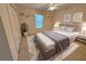 Modern bedroom featuring a plush bed, soft rug, floating shelves, and ample closet space at 16 Hunt Master Ct, Ormond Beach, FL 32174