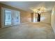 Primary bedroom with french doors to lanai, ensuite bath and walk-in closet at 16 Hunt Master Ct, Ormond Beach, FL 32174