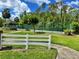 Community tennis courts, gazebo, and lush landscaping at 16 Hunt Master Ct, Ormond Beach, FL 32174