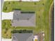 Aerial view of the home showcasing its roof, driveway, and landscaping at 2840 Monaghan Dr, Ormond Beach, FL 32174